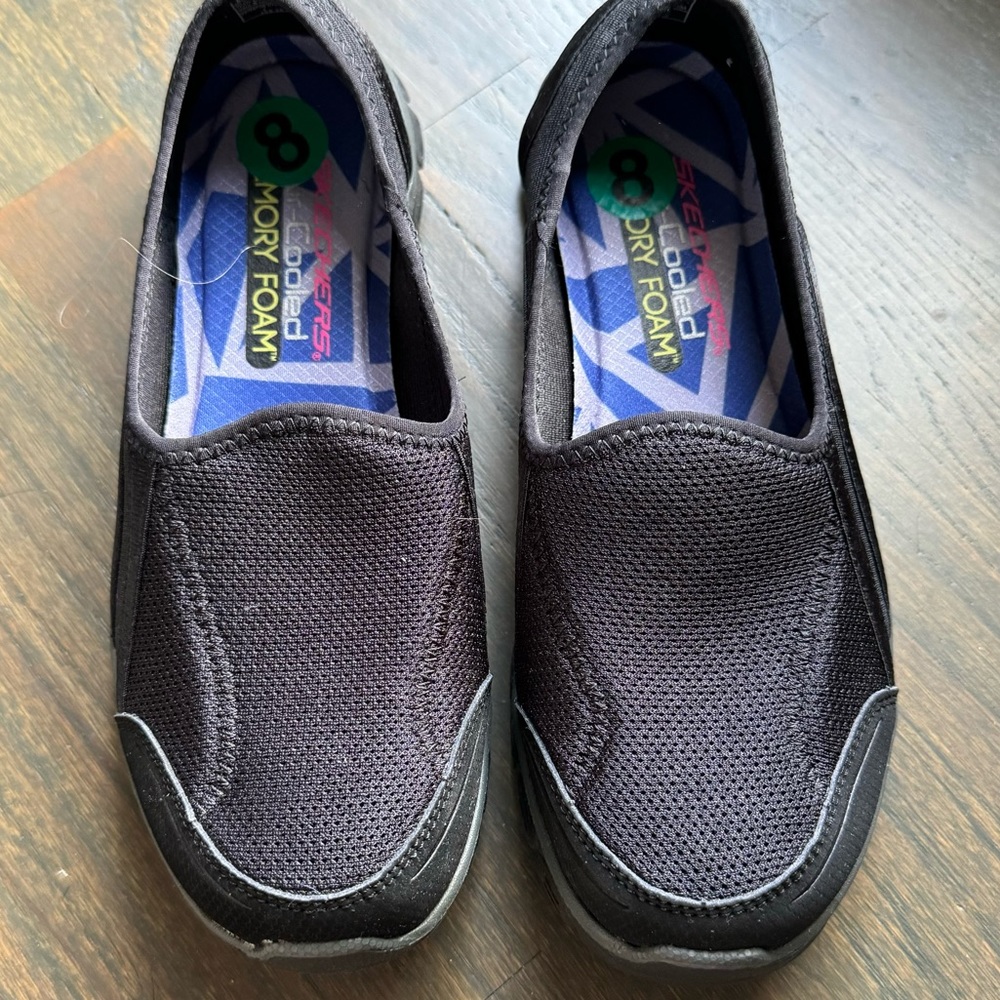 Sketchers black slip on walking shoes
